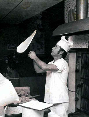 GRG chef tossing pizza dough - the art of great eating since 1998